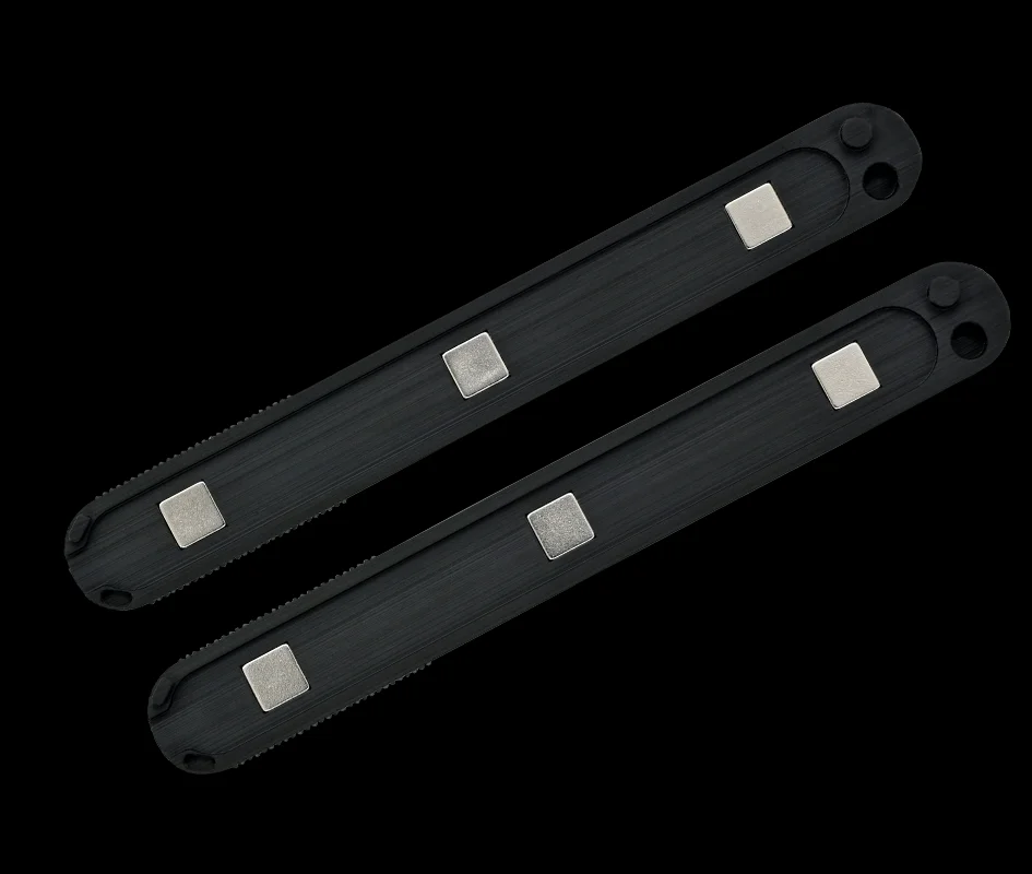 Two black magnetic ELITE HILO grips by Multipick with integrated neodymium magnets, tool-free attachment to lockpicking tools, on a black background