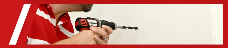 Drill a hole for the peephole with a cordless screwdriver